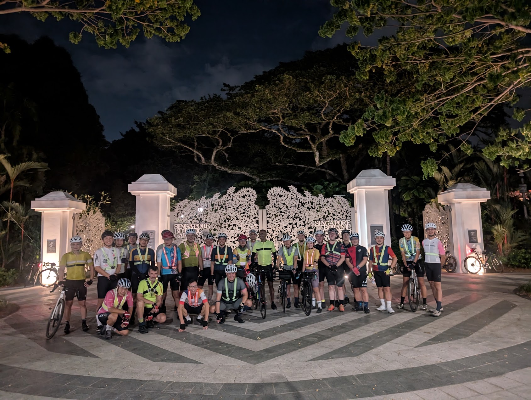 Randonneurs Singapore riders gathered at Singapore Botanic Gardens at night wearing reflective gear